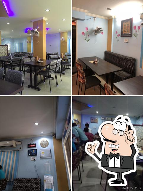 Take a seat at one of the tables at Bismillah Paradise Family Restaurant