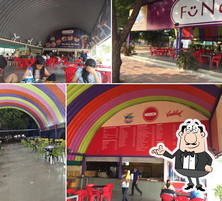 Take a seat at one of the tables at Fun and Food Restaurant