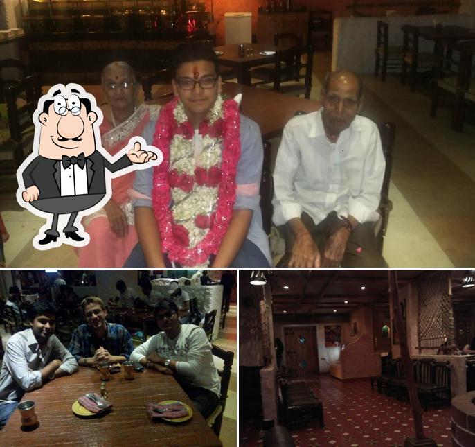 Take a seat at one of the tables at Angeethi restaurant