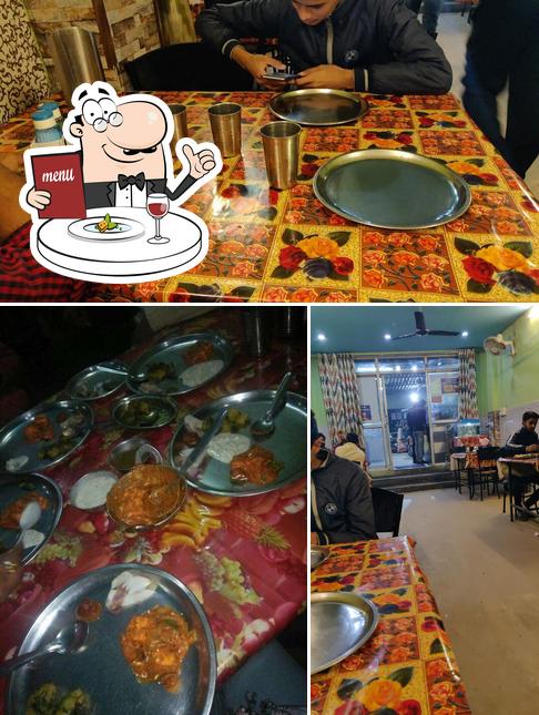 Among various things one can find food and dining table at Laziz Dhaba