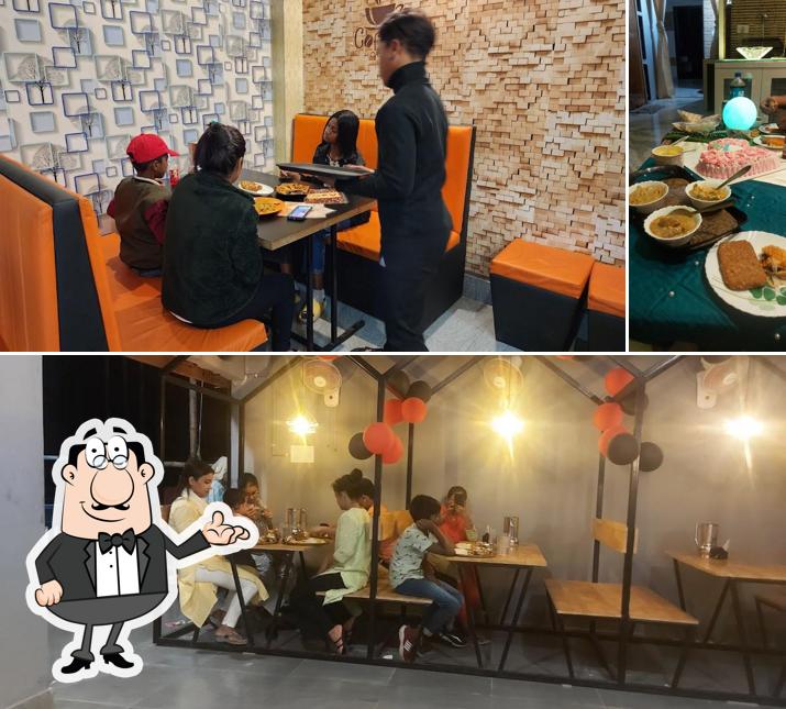 Check out the picture displaying interior and dining table at The Adda Hut