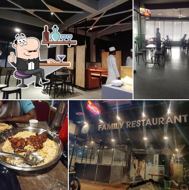 Take a seat at one of the tables at MIDWAY KUZHIMANDHI