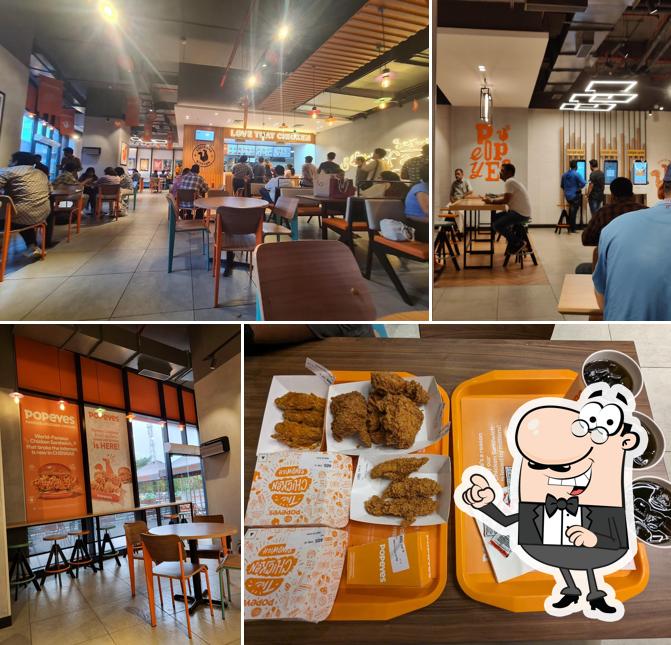 Take a seat at one of the tables at Popeyes - Famous Louisiana Chicken
