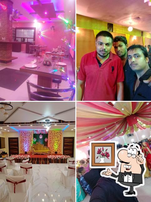Take a seat at one of the tables at Raj Gharana Family Restaurant