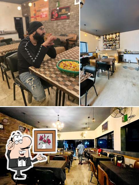 Take a seat at one of the tables at Deepak Garden Restro & Bar