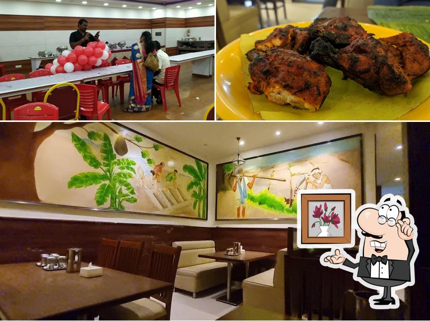 Take a seat at one of the tables at Navaladi kongunadu Restaurant & party hall