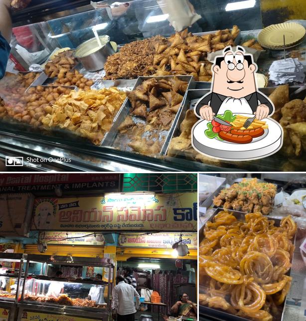 Take a look at the photo showing food and interior at Sri sai swagruha foods Corn samosa onion samosa