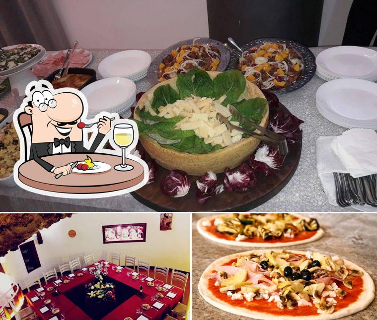 Ristorante Pizzeria Le Grotte si caratterizza per la cibo e tavolo da pranzo