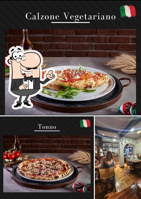 A imagem do Delizie di Dario Bistrô’s interior e comida
