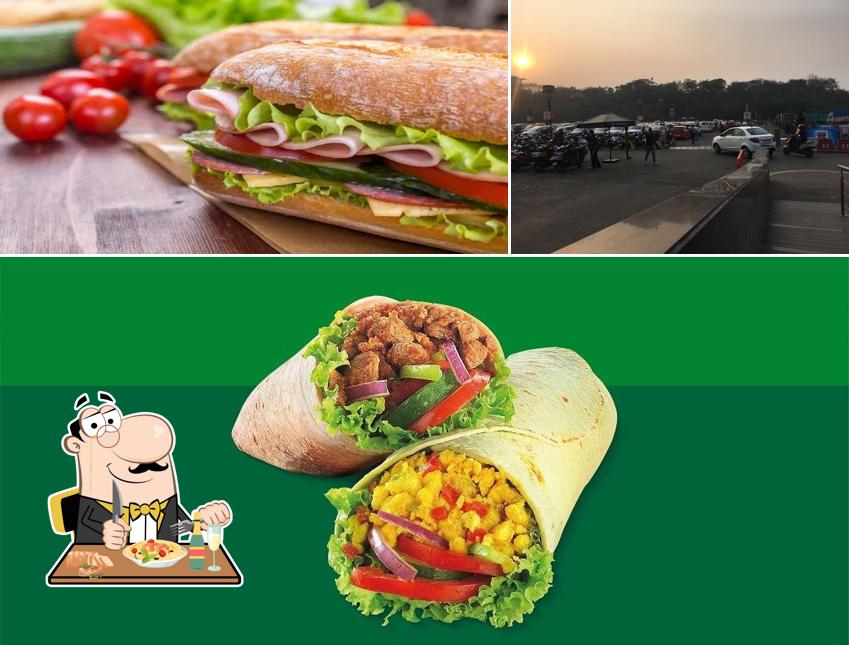 Check out the picture depicting food and exterior at Subway Malad West