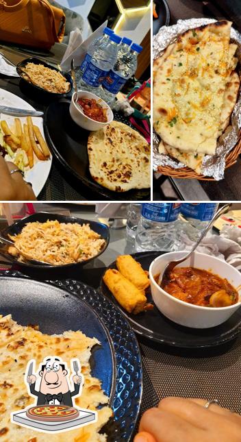 Try out pizza at Mahal Restaurant & Hotel