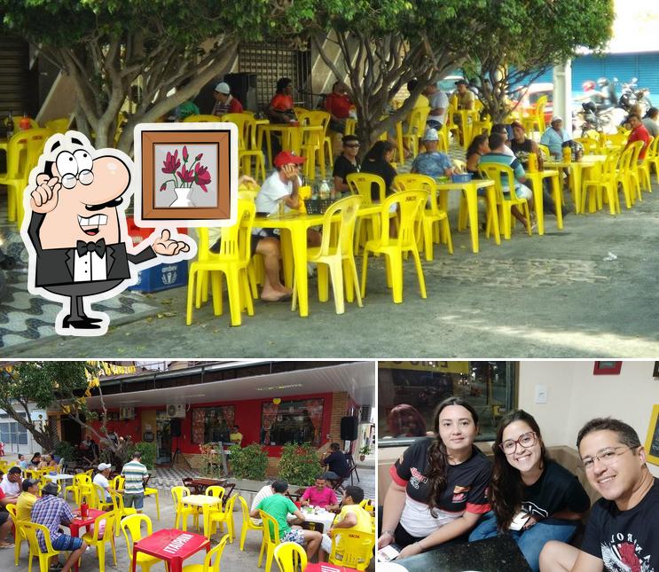 Sente em uma das mesas no EnioS Restaurante