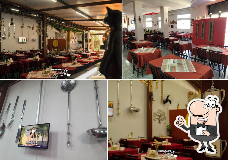 Sente em uma das mesas no Gato Gourmet: Restaurante de Comida Caseira
