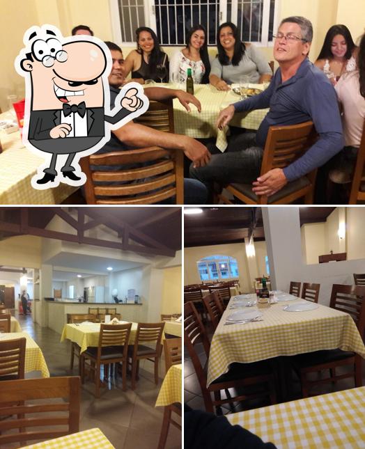 Sente em uma das mesas no Restaurante Barnabé