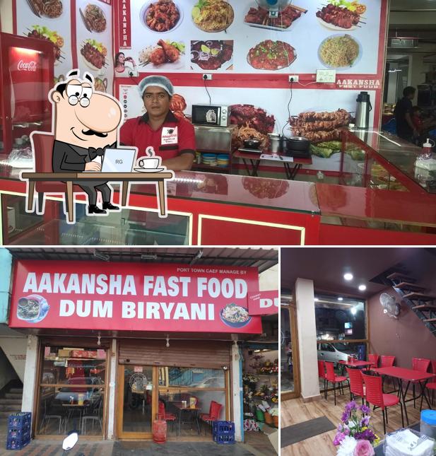 Take a seat at one of the tables at Aakansha Fast Food