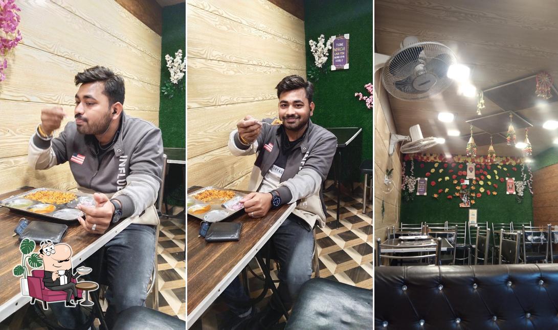 Take a seat at one of the tables at Hot & spicy cafe