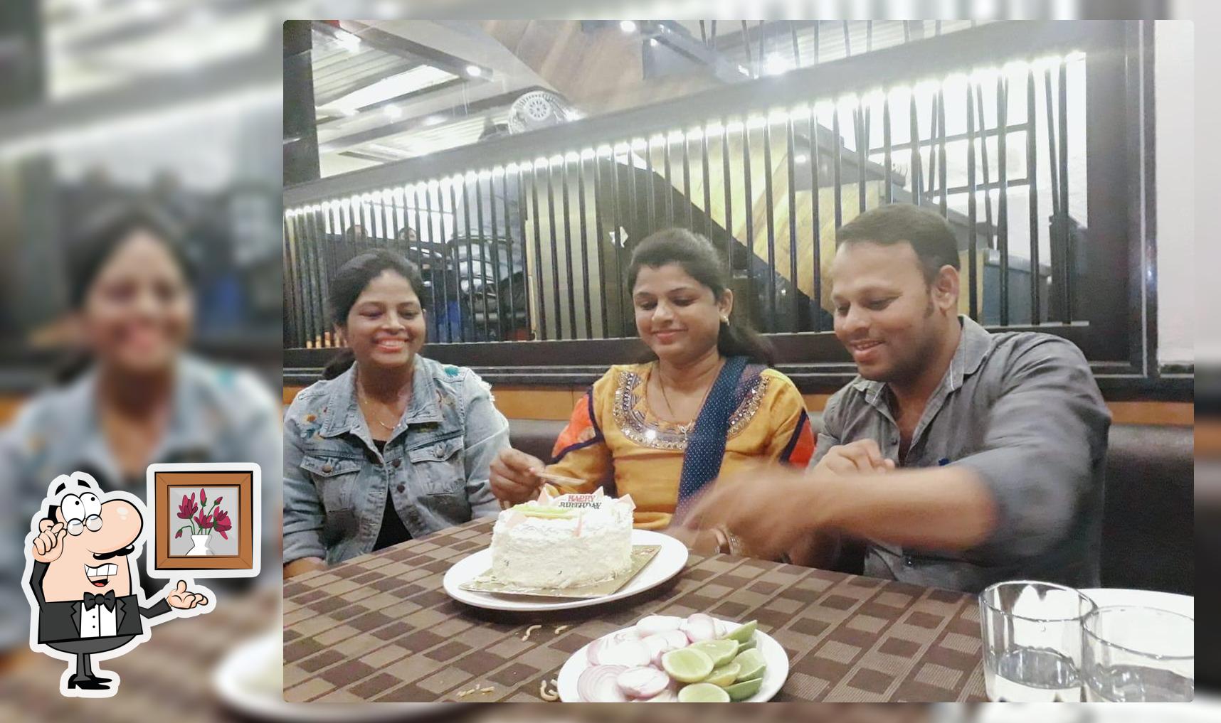 Take a seat at one of the tables at Malhar