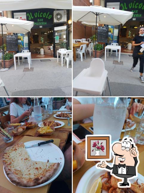 Questa è la foto che mostra la interni e tavolo da pranzo di Il Vicolo dal seve