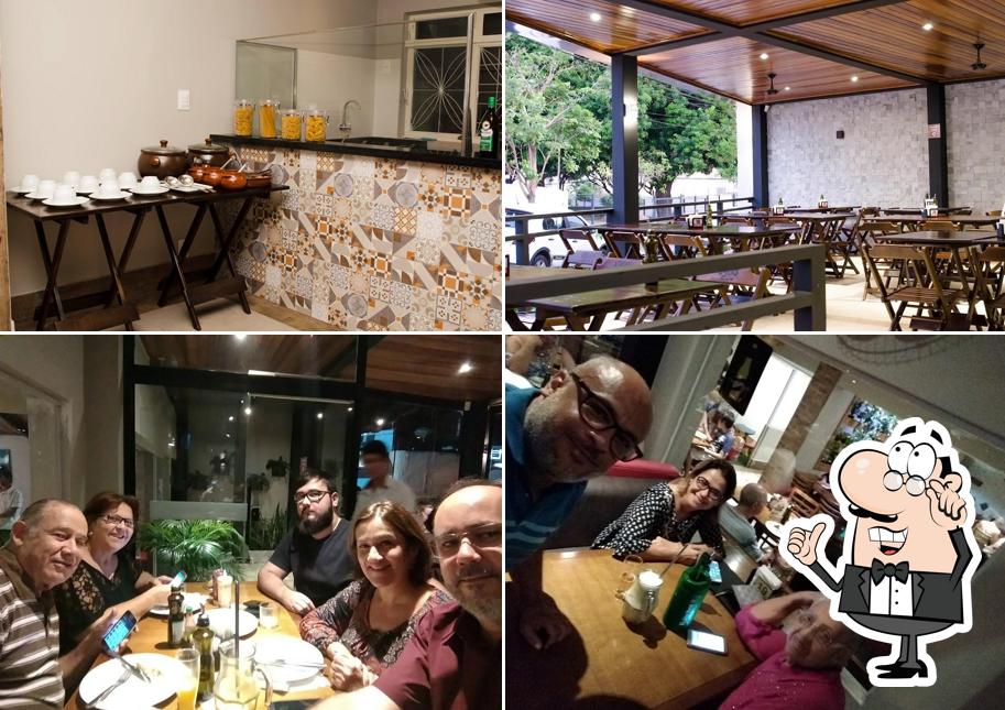 Sente em uma das mesas no Don Dito Pizzaria, Restaurante e Confeitaria
