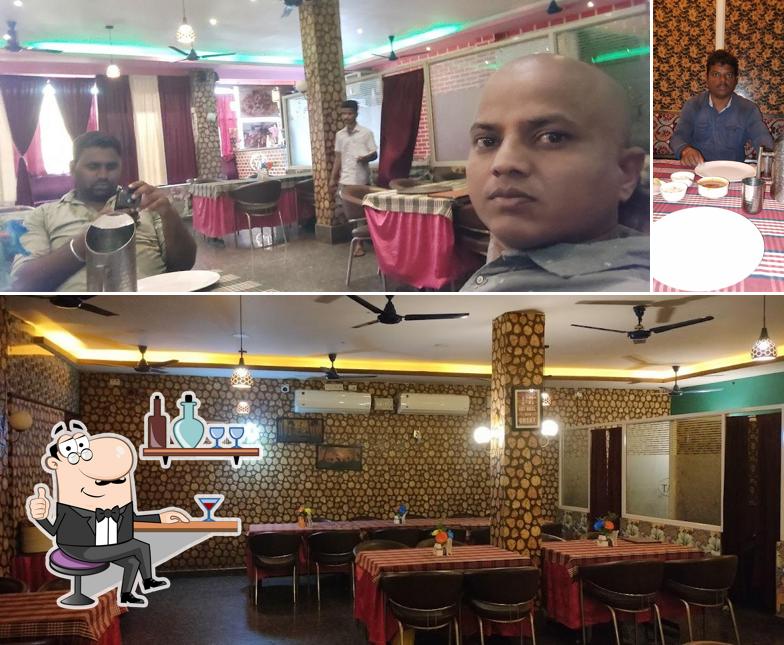 Take a seat at one of the tables at Taj Family Restaurant