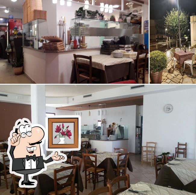Siediti a un tavolo di Pizzeria Trattoria Rogers