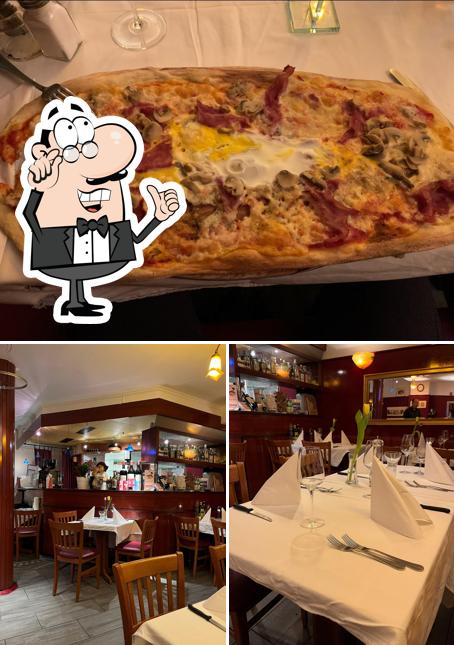 Guarda la foto che presenta la interni e pizza di Riviera