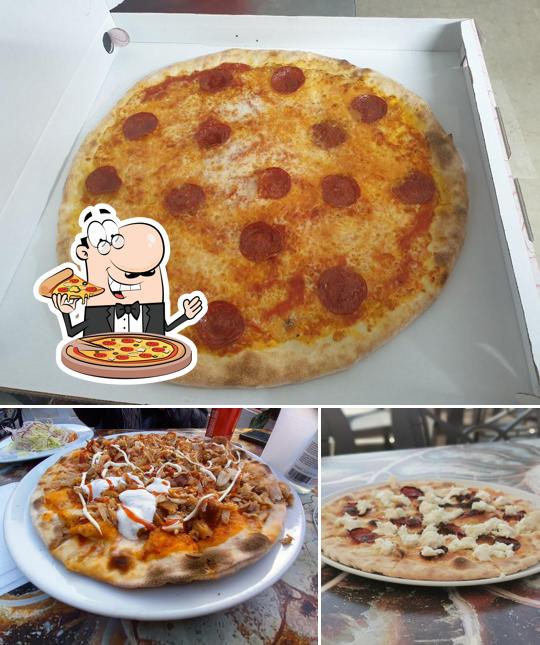 Prova una pizza a Ajwa Restaurant Bar Pizzeria & Kebab