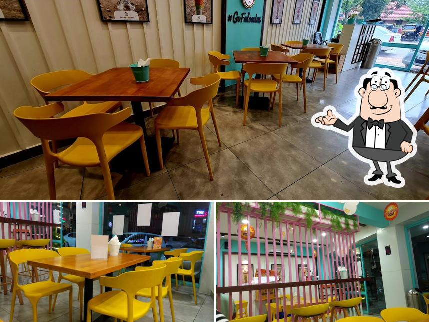 Take a seat at one of the tables at Falooda Nation Thiruvalla