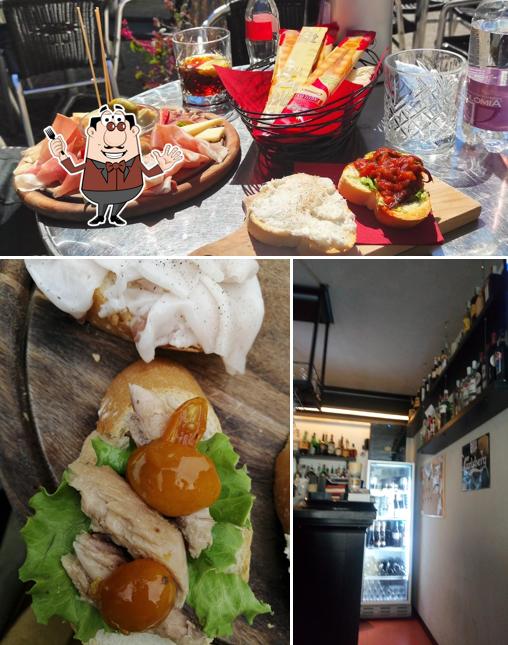 Guarda la foto che mostra la cibo e vino di sapore Di Vino