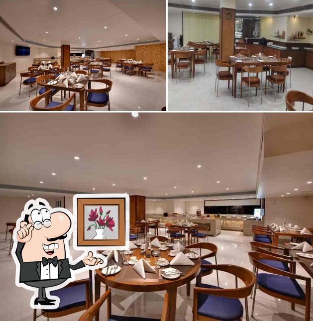 The interior of The Gourmet- An All Day Dining Restaurant By The Fern Residency