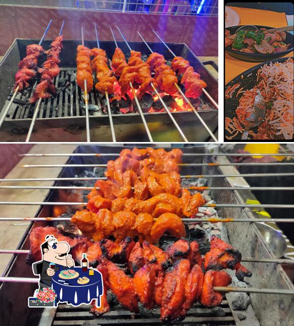 Order various seafood items served at Kebabs Era
