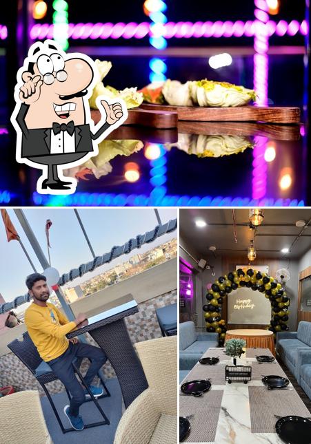 The photo of interior and food at Nirvana - The Rooftop Cafe