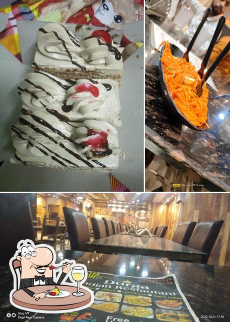 Take a look at the picture showing food and interior at Durga indian restaurant