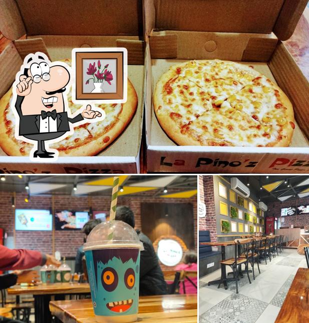 Take a look at the photo displaying interior and pizza at La Pino'z Pizza