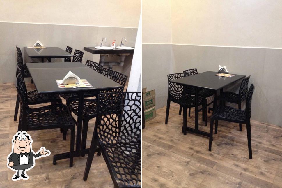 Take a seat at one of the tables at Parika Restaurant