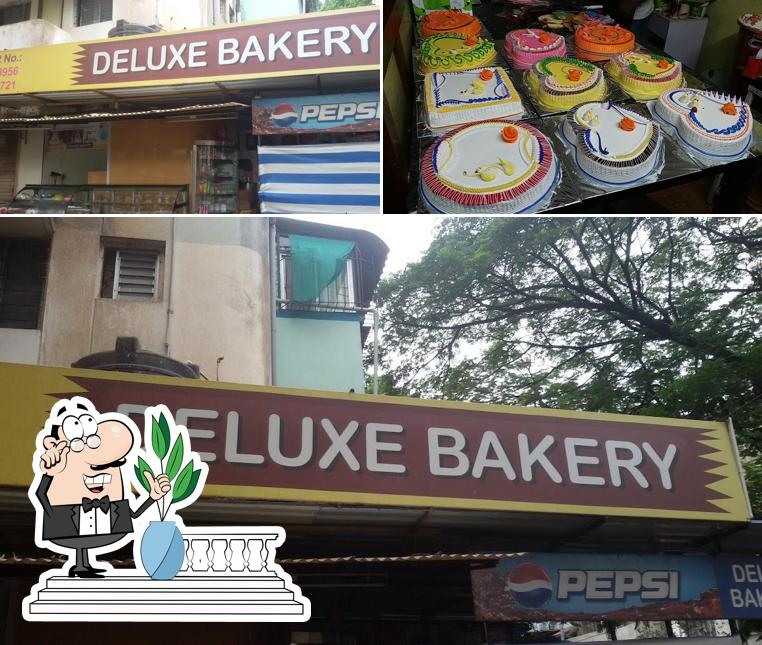 The picture of exterior and food at Cake Shop in Kolhapur - Deluxe Bakery