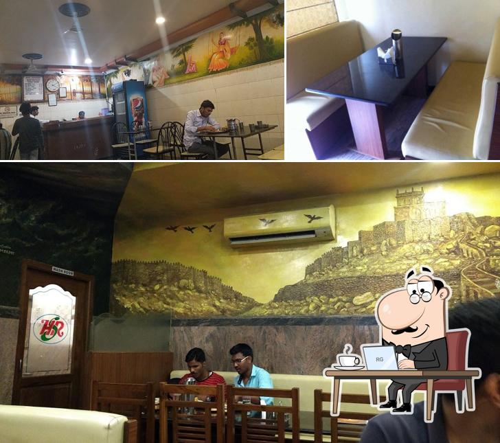 Take a seat at one of the tables at Hyderabad Shahi Restaurant