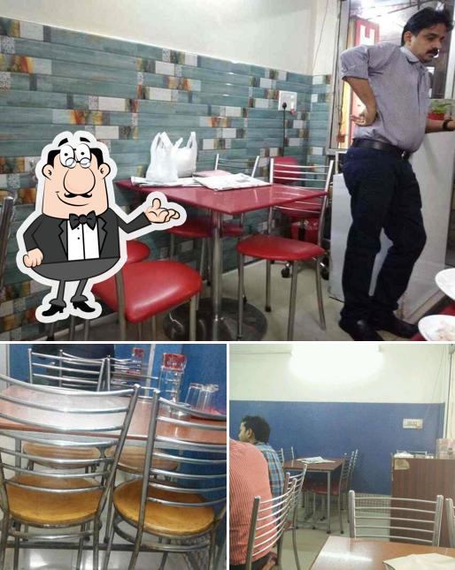 Take a seat at one of the tables at Malabar Restaurant