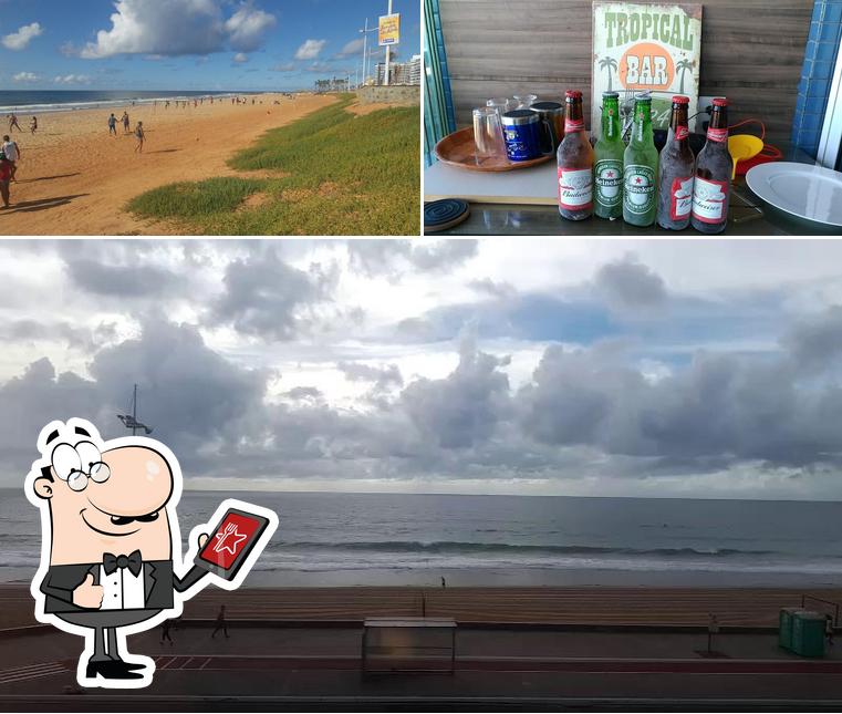 Esta é a ilustração ilustrando exterior e cerveja no Hotel Oceânico