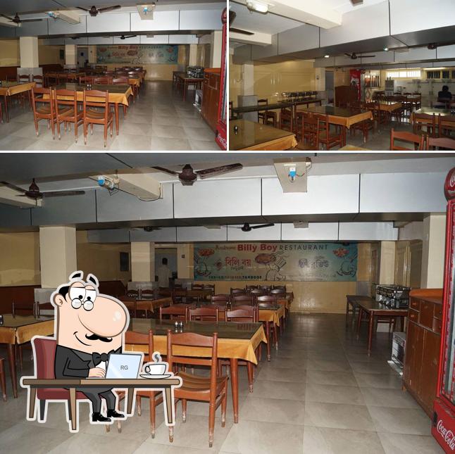 Take a seat at one of the tables at Billy Boy Restaurant Digha