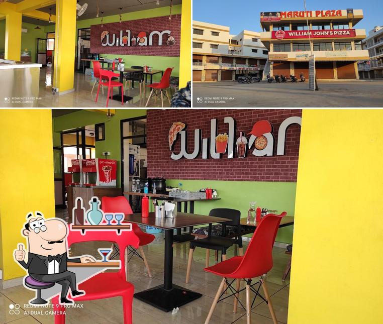 The photo of interior and exterior at William John's Pizza Karjan