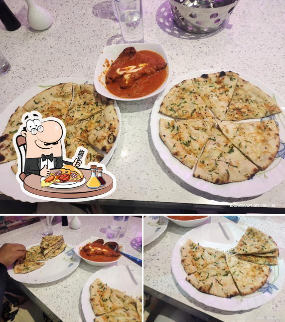 Get pizza at Oasis 69 Restaurant Cum Bar
