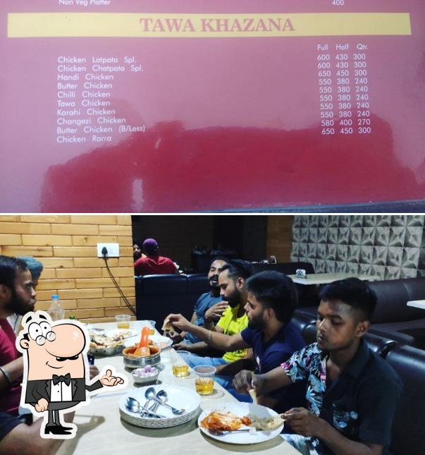 Take a seat at one of the tables at Peshawari chicken corner