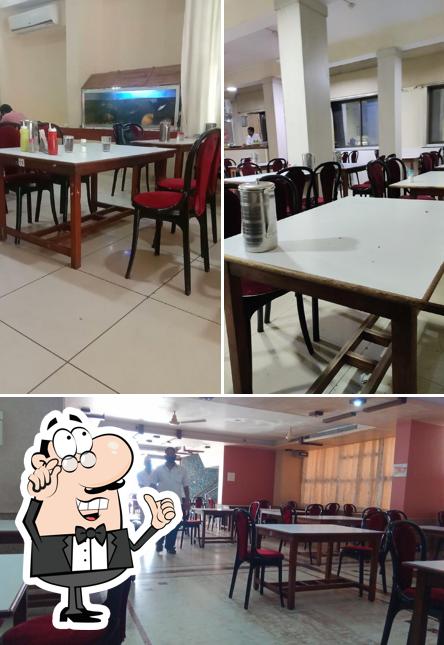 Take a seat at one of the tables at Indian Coffee House Jabalpur