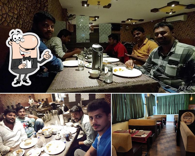 Take a seat at one of the tables at Suraksha's Biryani House