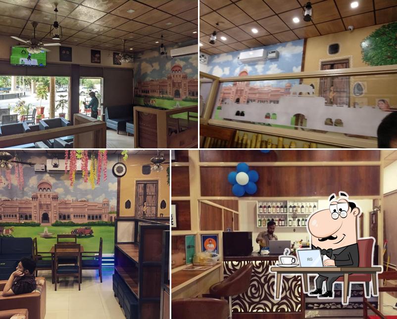 Take a seat at one of the tables at The Royal Bangla Cafe T.R.B Cafe