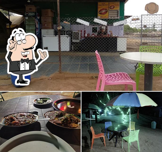 The photo of interior and food at Highway Hut Restaurant
