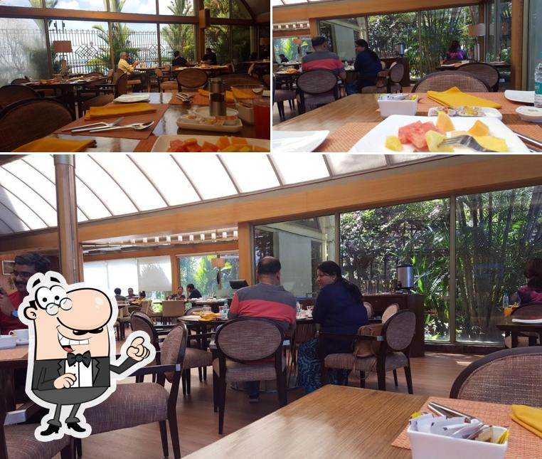 Take a seat at one of the tables at Bubble Cafe - Vivanta Ernakulam