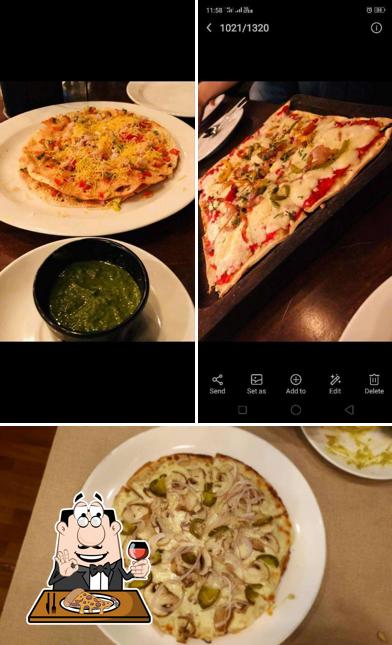 Pick pizza at By The Drive