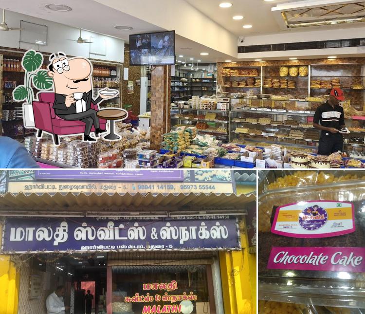Take a seat at one of the tables at Malathi Sweet and Snacks